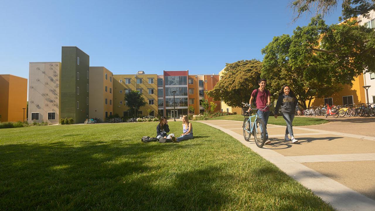 students walk through tercero quad on campus