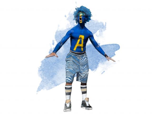 A UC Davis fan sports blue body paint and a blue wig to support the Aggies