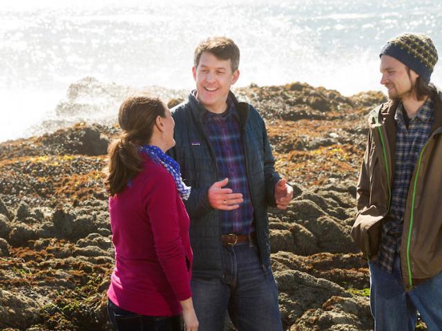 A professor discusses tidal pools with two students at the UC Davis Bodega Bay Marine lab