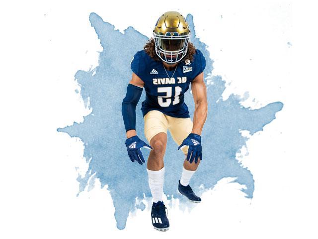 A UC Davis football player poses in his ready stance.